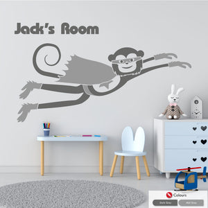 
            
                Load image into Gallery viewer, Cheeky monkey superhero flying wall decal with space for personalised name of your choice in dark grey &amp;amp; mid grey colours
            
        
