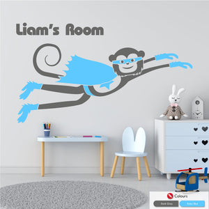 
            
                Load image into Gallery viewer, Cheeky monkey superhero flying wall decal with space for personalised name of your choice in dark grey and baby blue
            
        